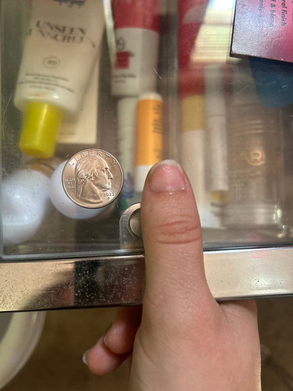 Example: right thumb beside a coin