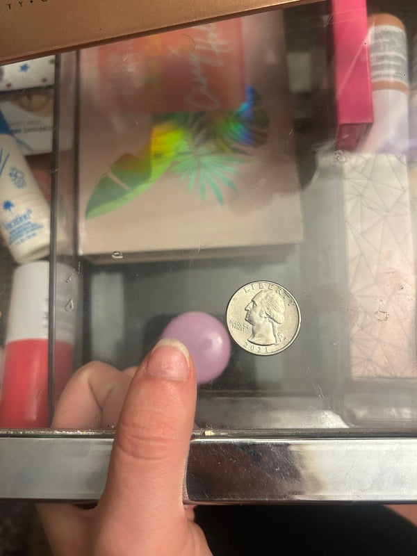 Example: left thumb beside a coin